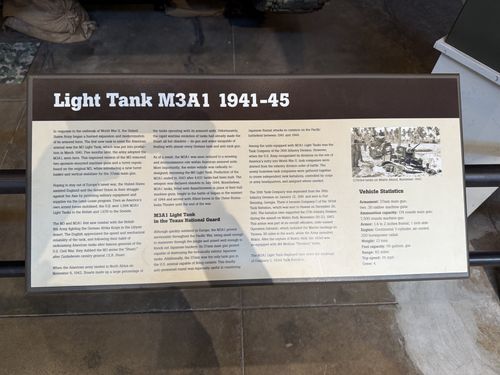 A clear placard for the 'Light Tank M3A1 1941-45', with a subsection 'M3A1 Light Tank in the Texas National Guard', a black-and-white photo captioned about Makin Island November 1943, and a Vehicle Statistics box. Fully legible.