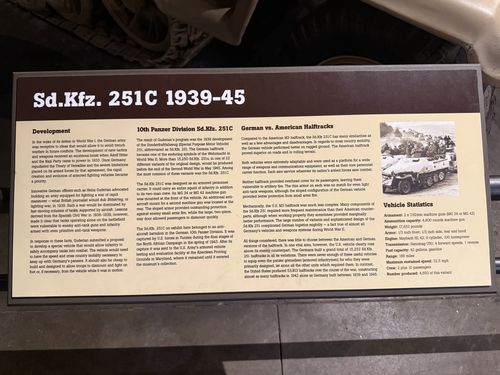 Placard titled 'Sd.Kfz. 251C 1939-45' photographed upside down (rotated 180 degrees). Sections cover Development, '10th Panzer Division Sd.Kfz. 251C', and 'German vs. American Halftracks', plus a Vehicle Statistics box and a historic photo of an overturned halftrack.