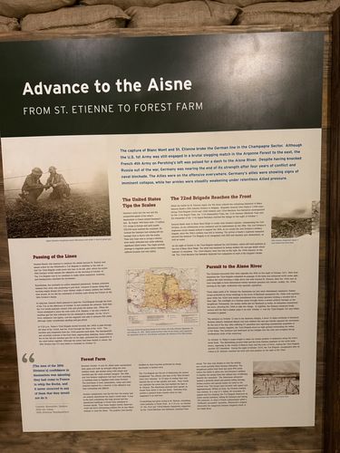 Tall story panel titled 'Advance to the Aisne - From St. Etienne to Forest Farm,' with sections 'The United States Tips the Scales,' 'The 72nd Brigade Reaches the Front,' 'Passing of the Lines,' 'Pursuit to the Aisne River,' and 'Forest Farm,' plus battlefield photos, a sector map, and a quote.