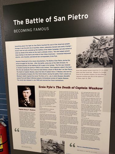 Same 'The Battle of San Pietro / Becoming Famous' panel as index 81, shot straighter and sharper. Portrait of Captain Henry T. Waskow at left, Ernie Pyle photo at right, full text of Pyle's column 'The Death of Captain Waskow'.