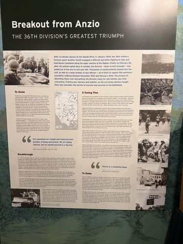 Large wall panel titled 'Breakout from Anzio / The 36th Division's Greatest Triumph', with several period photos and text columns under 'To Anzio', 'A Daring Plan', 'Breakthrough', and 'To Rome'.
