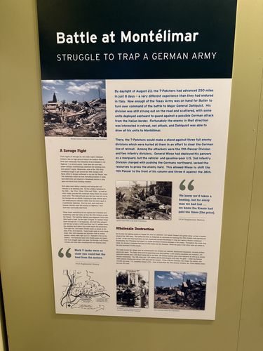 Wall panel titled 'Battle at Montelimar' with a photo of wrecked German artillery, two columns of text, two pull quotes, and small photos at the bottom of destruction along a roadway.